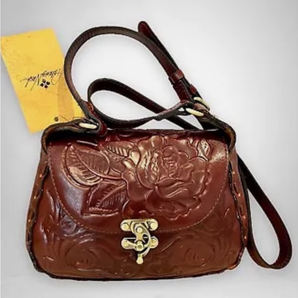 Patricia Nash 100% Lucia tooled leather medium/large Crossbody Saddle Purse.